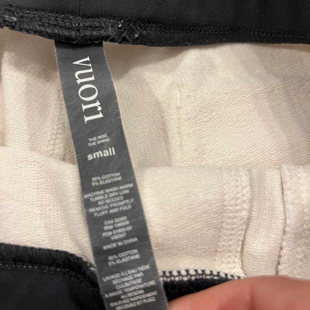 Vuori light weight ladies joggers in cream with charcoal accents. Size small